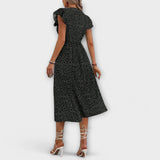 Vestido midi elegante con lunares